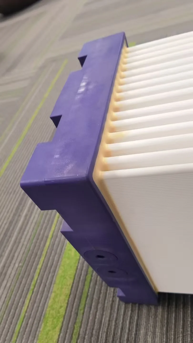 Side close-up of ceramic flat sheet membrane plates and purple module end frame