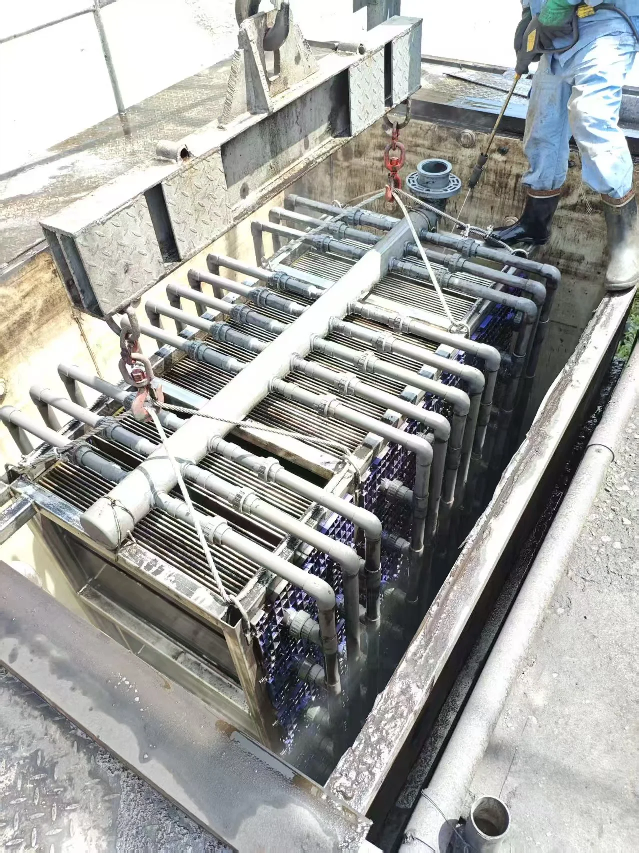 Ceramic flat sheet membrane modules installed in a submerged treatment tank